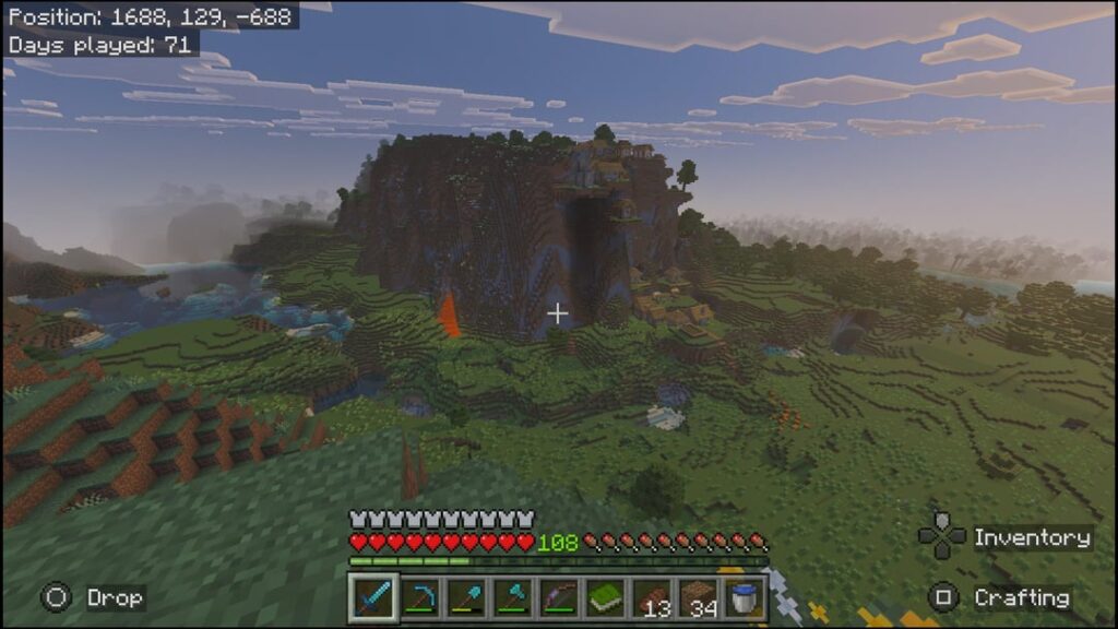 渓谷と川のある崖沿いの村