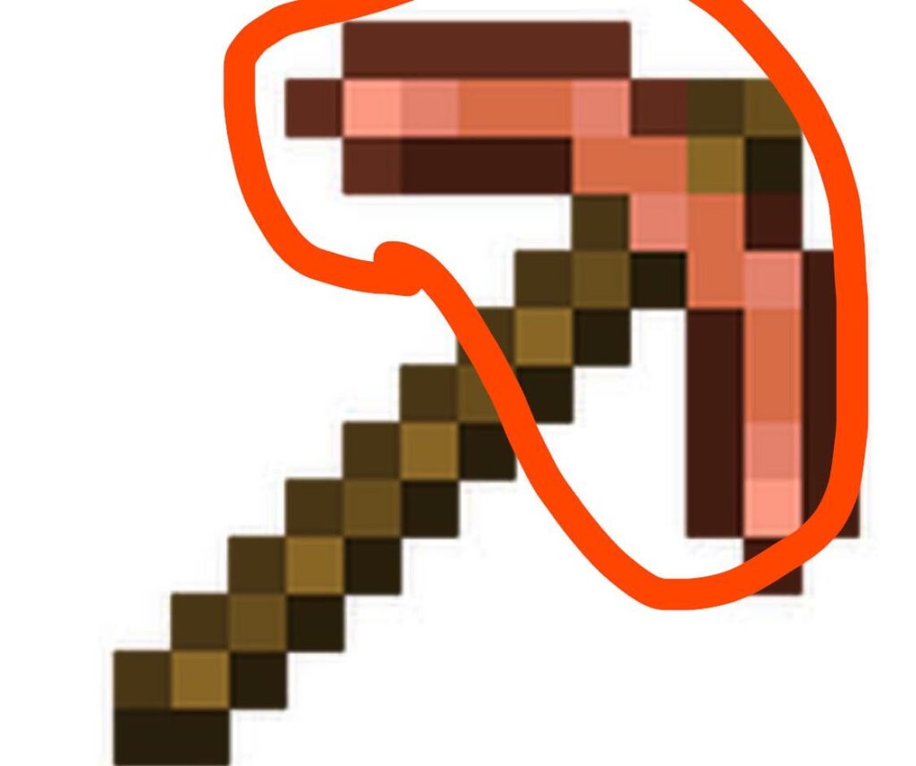 銅のつるはしは棒についたソーセージのように見える