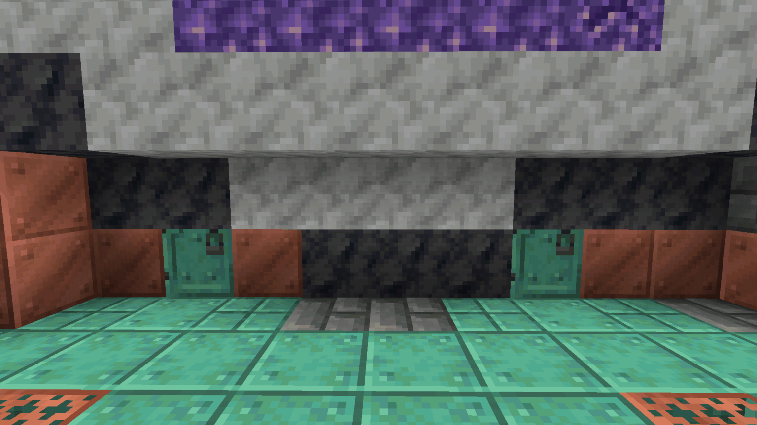 半分ワックスがけされた酸化銅のドアが 2 つ並んでいます。