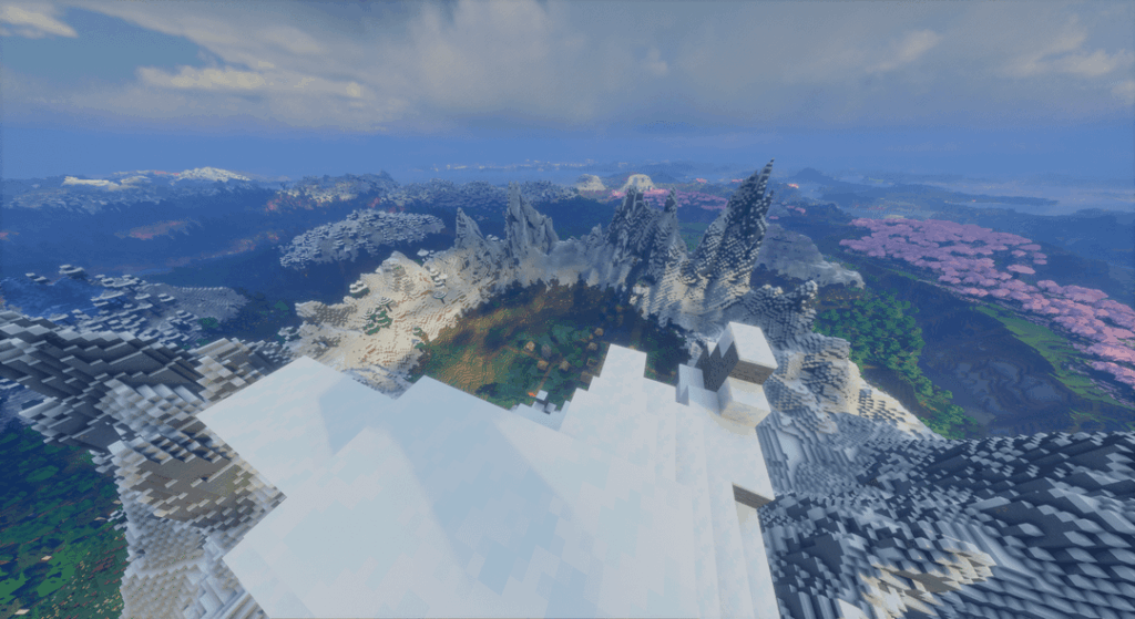 放棄された村を囲む雪の山と、周囲のさまざまなバイオームを持つクールなシード