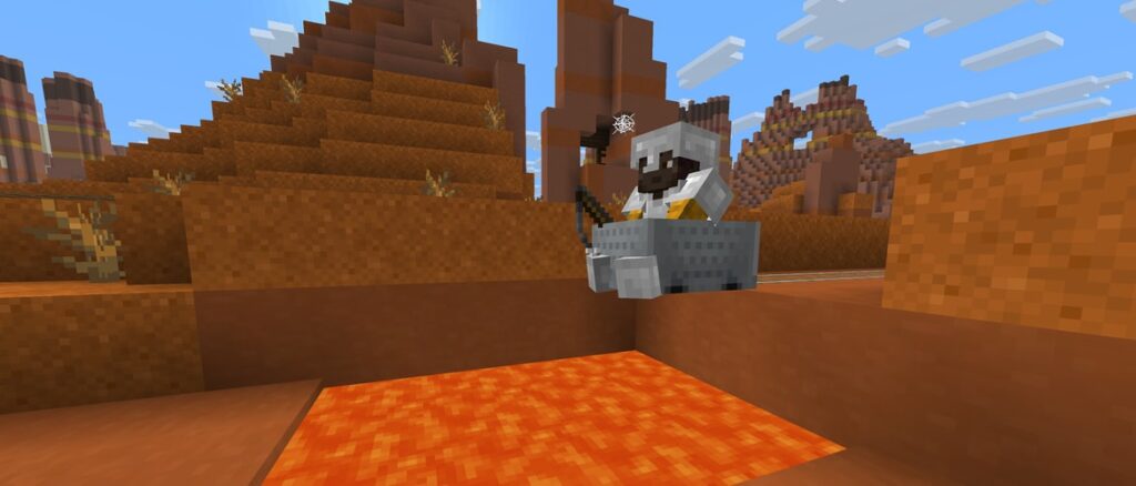 Makena is riding a Minecart in Badlands into a lava pit.
