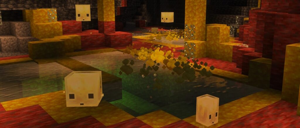 Two player characters inside a sulfur cave surrounded by several sulfur cubes